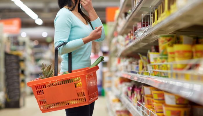 Consumer Browsing Supermarket Shelves